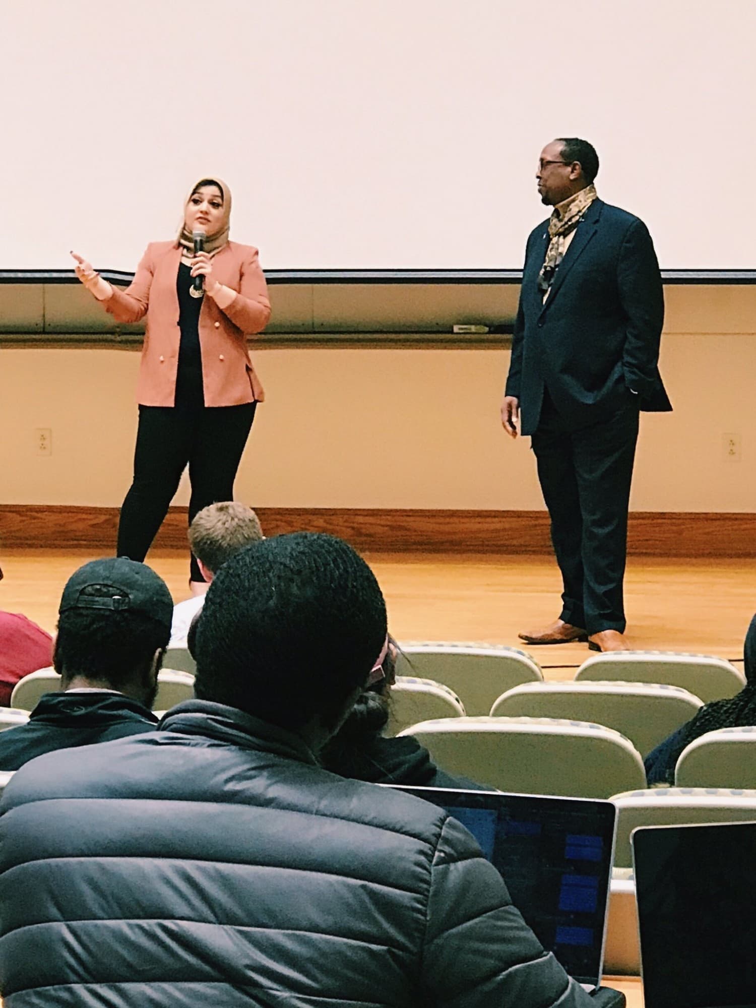 Nura Sediqe speaking at a community event